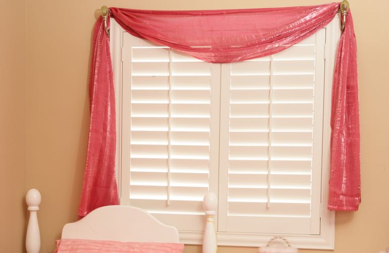 Girl's room with white shutters.